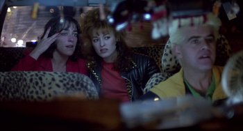 Movie still from “Women on the Verge of a Nervous Breakdown” (1988), directed by Pedro Almodóvar – A group of people sitting on a couch; Close Up shot, Over the shoulder angle