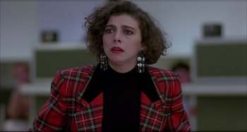 Movie still from “Women on the Verge of a Nervous Breakdown” (1988), directed by Pedro Almodóvar – A woman in a red plaid jacket and black shirt; Close Up shot, Low angle