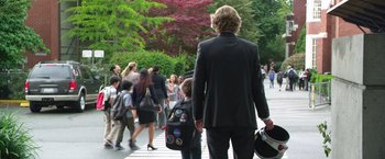 Movie still from “Wonder” (2017), directed by Stephen Chbosky – A crowd of people walking down a sidewalk; Wide shot, Over the shoulder angle