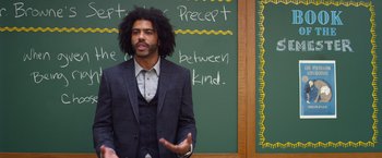 Movie still from “Wonder” (2017), directed by Stephen Chbosky – A man in a suit standing in front of a chalkboard; Medium shot, Over the shoulder angle