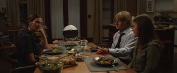 Movie still from “Wonder” (2017), directed by Stephen Chbosky – Two people sitting at a table with plates of food; Medium shot, Over the shoulder angle