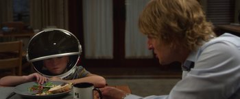 Movie still from “Wonder” (2017), directed by Stephen Chbosky – Two people sitting at a table with a coffee mug; Close Up shot, Over the shoulder angle