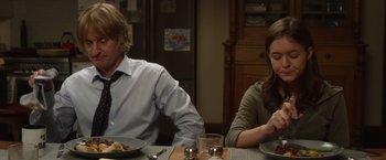 Movie still from “Wonder” (2017), directed by Stephen Chbosky – A man and a woman sitting at a dinner table; Medium shot, Over the shoulder angle