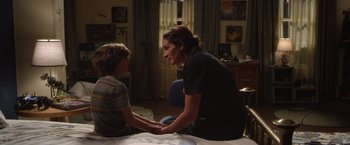 Movie still from “Wonder” (2017), directed by Stephen Chbosky – A woman and a boy sitting in a room; Medium shot, Over the shoulder angle