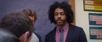 Movie still from “Wonder” (2017), directed by Stephen Chbosky – A man in a suit and tie standing next to another man in a suit; Close Up shot, Over the shoulder angle
