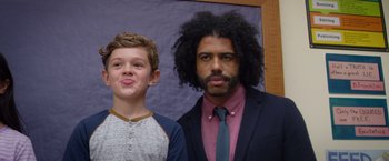 Movie still from “Wonder” (2017), directed by Stephen Chbosky – A man and a boy standing next to each other; Close Up shot, Over the shoulder angle