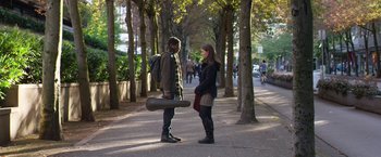 Movie still from “Wonder” (2017), directed by Stephen Chbosky – A man and a woman standing next to each other on a sidewalk; Wide shot, Over the shoulder angle