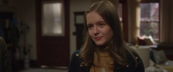 Movie still from “Wonder” (2017), directed by Stephen Chbosky – A woman with long brown hair wearing a yellow sweater; Close Up shot, Over the shoulder angle