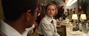 Movie still from “Wonder” (2017), directed by Stephen Chbosky – A woman in a dress shirt and tie looking at a man in glasses; Medium shot, Over the shoulder angle