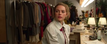 Movie still from “Wonder” (2017), directed by Stephen Chbosky – A woman in a white shirt and red bow tie; Medium shot, Over the shoulder angle