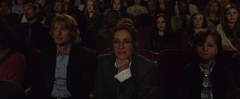 Movie still from “Wonder” (2017), directed by Stephen Chbosky – A group of people sitting in a room; Medium shot, Over the shoulder angle