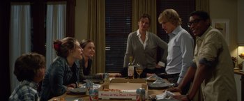 Movie still from “Wonder” (2017), directed by Stephen Chbosky – A group of people sitting around a table; Medium shot, Over the shoulder angle