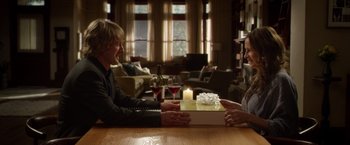 Movie still from “Wonder” (2017), directed by Stephen Chbosky – Two people sitting at a table in front of a lit candle; Medium shot, Over the shoulder angle