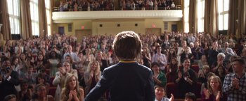 Movie still from “Wonder” (2017), directed by Stephen Chbosky – A crowd of people sitting in front of an audience; Wide shot, Over the shoulder angle