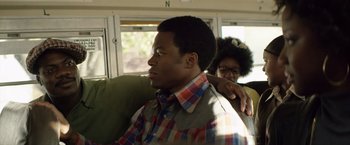 Movie still from “Woodlawn” (2015), directed by Jon Erwin – A man and a woman sitting on a couch; Close Up shot, Over the shoulder angle