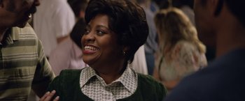 Movie still from “Woodlawn” (2015), directed by Jon Erwin – A person wearing a green shirt; Close Up shot, Over the shoulder angle