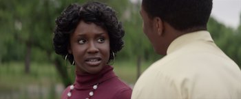 Movie still from “Woodlawn” (2015), directed by Jon Erwin – A woman in a red shirt is talking to a man in a white shirt; Close Up shot, Over the shoulder angle