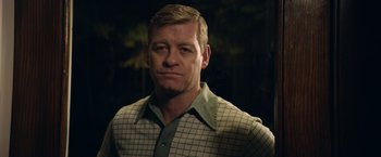 Movie still from “Woodlawn” (2015), directed by Jon Erwin – A person wearing a plaid shirt; Close Up shot, Over the shoulder angle