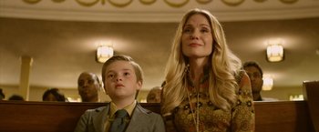 Movie still from “Woodlawn” (2015), directed by Jon Erwin – A woman and a boy sitting in front of each other; Close Up shot, Low angle