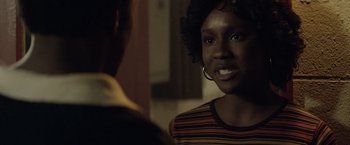 Movie still from “Woodlawn” (2015), directed by Jon Erwin – A woman is talking to another woman in a room; Close Up shot, Over the shoulder angle