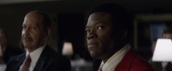 Movie still from “Woodlawn” (2015), directed by Jon Erwin – A person wearing a red and white shirt; Close Up shot, Over the shoulder angle