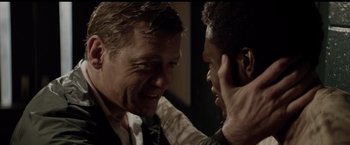 Movie still from “Woodlawn” (2015), directed by Jon Erwin – A man and a woman are talking to each other; Close Up shot, Over the shoulder angle