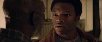 Movie still from “Woodlawn” (2015), directed by Jon Erwin – A person looking at another person; Close Up shot, Over the shoulder angle