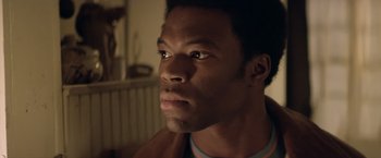 Movie still from “Woodlawn” (2015), directed by Jon Erwin – A person looking at the camera; Close Up shot, Low angle