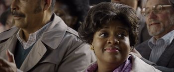 Movie still from “Woodlawn” (2015), directed by Jon Erwin – A person sitting in a room; Close Up shot, Over the shoulder angle