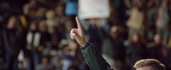 Movie still from “Woodlawn” (2015), directed by Jon Erwin – A person with their hand up in the air; Close Up shot, Low angle