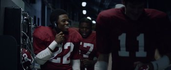 Movie still from “Woodlawn” (2015), directed by Jon Erwin – A group of football players in a tunnel; Close Up shot, Low angle