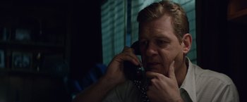 Movie still from “Woodlawn” (2015), directed by Jon Erwin – A person talking on a cell phone; Close Up shot, Over the shoulder angle