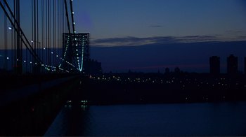 Movie still from “World Trade Center” (2006), directed by Oliver Stone – A view of a bridge lit up at night; Extreme Wide shot, High angle