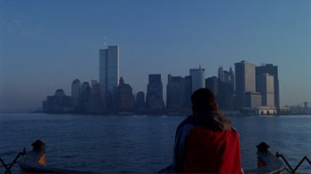 Movie still from “World Trade Center” (2006), directed by Oliver Stone – A person looking out over a body of water; Extreme Wide shot, Over the shoulder angle