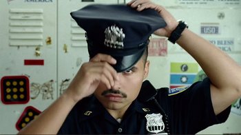 Movie still from “World Trade Center” (2006), directed by Oliver Stone – A man in a police uniform putting on a hat; Close Up shot, Low angle