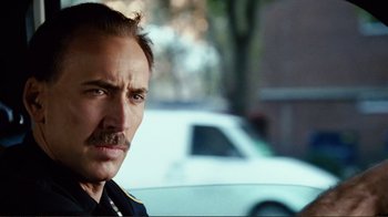 Movie still from “World Trade Center” (2006), directed by Oliver Stone – A person with a mustache; Close Up shot, Over the shoulder angle
