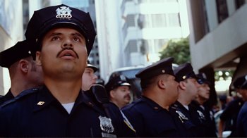 Movie still from “World Trade Center” (2006), directed by Oliver Stone – A group of police officers standing in front of a building; Close Up shot, Low angle