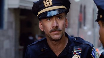 Movie still from “World Trade Center” (2006), directed by Oliver Stone – A man in a police uniform with a mustache; Close Up shot, Low angle