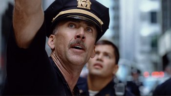 Movie still from “World Trade Center” (2006), directed by Oliver Stone – Two police officers are standing next to each other; Close Up shot, Low angle