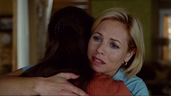 Movie still from “World Trade Center” (2006), directed by Oliver Stone – A person hugging another person; Close Up shot, Over the shoulder angle