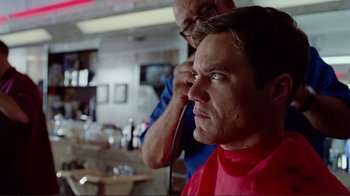 Movie still from “World Trade Center” (2006), directed by Oliver Stone – A man getting his hair combed by a barber; Close Up shot, Over the shoulder angle