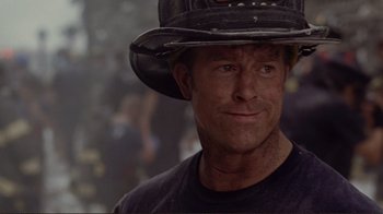 Movie still from “World Trade Center” (2006), directed by Oliver Stone – A person wearing a hat; Close Up shot, Over the shoulder angle