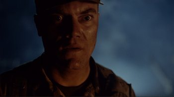 Movie still from “World Trade Center” (2006), directed by Oliver Stone – A man in a military uniform stares at the camera; Close Up shot, Low angle
