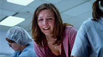 Movie still from “World Trade Center” (2006), directed by Oliver Stone – A person sitting on the ground; Close Up shot, Low angle