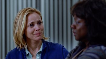 Movie still from “World Trade Center” (2006), directed by Oliver Stone – Two women are talking to each other in front of a wall; Close Up shot, Over the shoulder angle