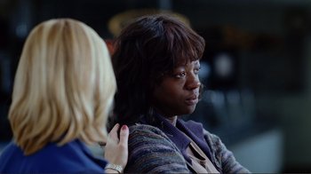 Movie still from “World Trade Center” (2006), directed by Oliver Stone – Two women are sitting in front of each other; Close Up shot, Over the shoulder angle