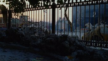 Movie still from “World Trade Center” (2006), directed by Oliver Stone – A view of a city from behind a fence; Extreme Wide shot, Low angle