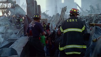 Movie still from “World Trade Center” (2006), directed by Oliver Stone – A group of firemen standing next to each other; Medium shot, Low angle