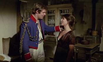 Movie still from “Woyzeck” (1979), directed by Werner Herzog – A man and a woman are dressed up and smiling; Medium shot, Over the shoulder angle