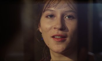 Movie still from “Woyzeck” (1979), directed by Werner Herzog – A young woman's face; Close Up shot, Over the shoulder angle